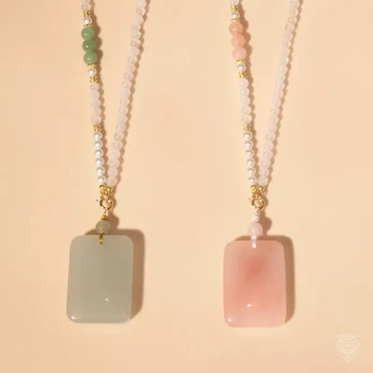 Natural green jade and pink quartz Wu Shi tag pendant necklaces with beaded pearl chains.
