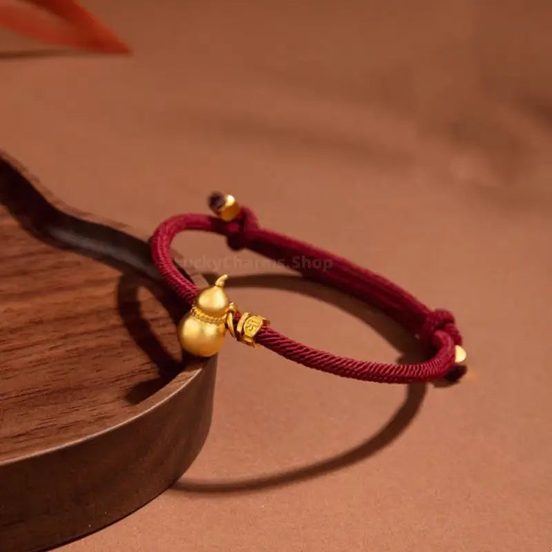 Mount Wutai Blessed Everlasting Blessings of Fortune and Emoluments Gold-Plated Gourd Red Bracelet | Adjustable Drawstring, High-Density Braided Cotton Rope-LuckyCharms.Shop
