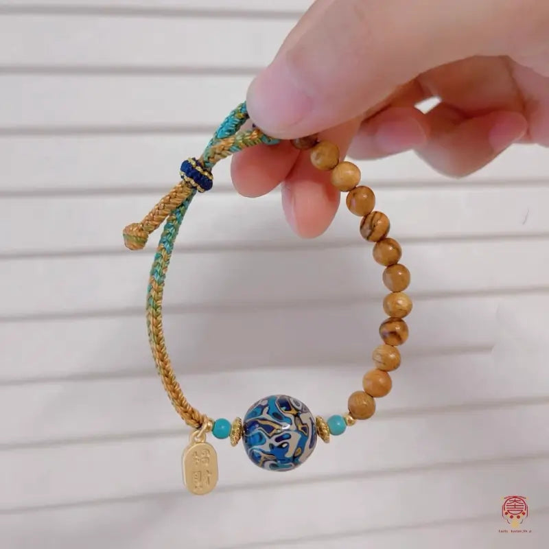 Heritage Lacquer & Gold-Thread Nanmu Wood Bracelet - Hand-Braided Cord