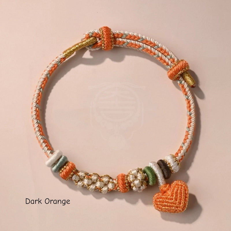 Bracelet tressé fait main en nœud de fleur de pêcher avec breloque cœur