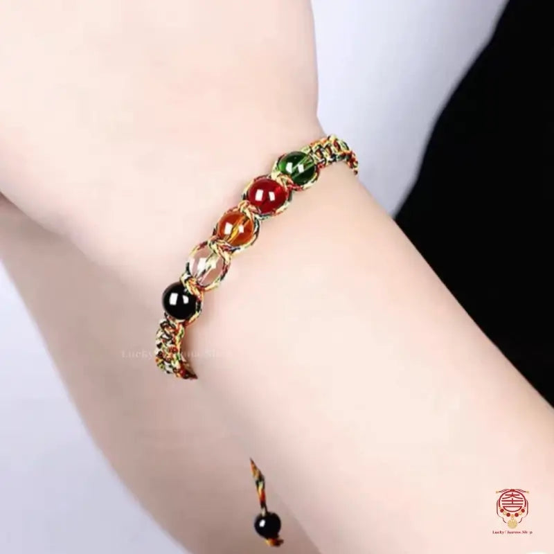 Model styling the five elements protection knot rope bracelet on a wrist for a minimalist, mindful look.