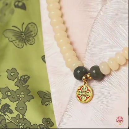The Sovereign Wheel Mala - Organic 6x8mm White Jade Bodhi & Golden Dharma Wheel Strand