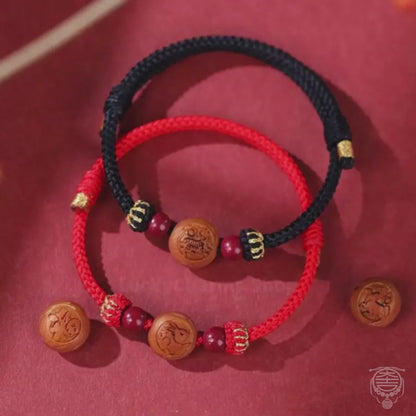 The Heritage Guardian Cord - Dual-Sided 13mm Hand-Carved Peach Pit Zodiac & Cinnabar Bracelet