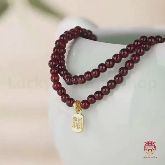 Mount Putuo Blessed Garnet Bracelet | Three-Layer, Fortune-turning Jade Bead, Gold-Plated Fortune Charm, New Chinese Style
