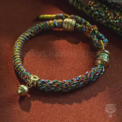The Shambala Bell - Hand-Woven Tibetan Chromatic Silk Bracelet with Gold Mantra Cylinder
