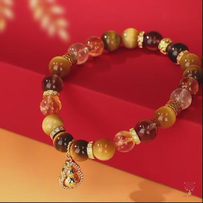 Bracelet en œil de tigre et pendentif gourde rotatif du musée du Palais
