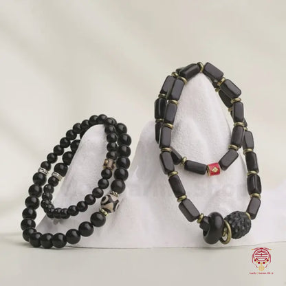 The Tibetan Citadel Mala - Blessed Mystic Ebony Wood with Three-Eyed Dzi & Lu Lu Tong