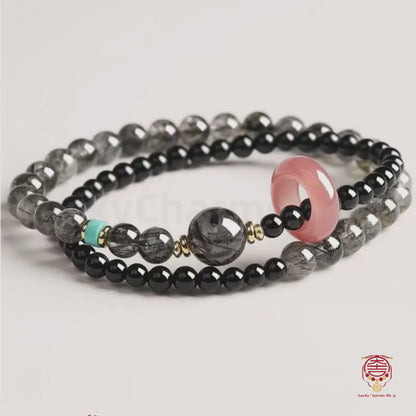 Le Mala éclipse de Putuo - Bracelet en obsidienne noire naturelle et quartz rose bénis